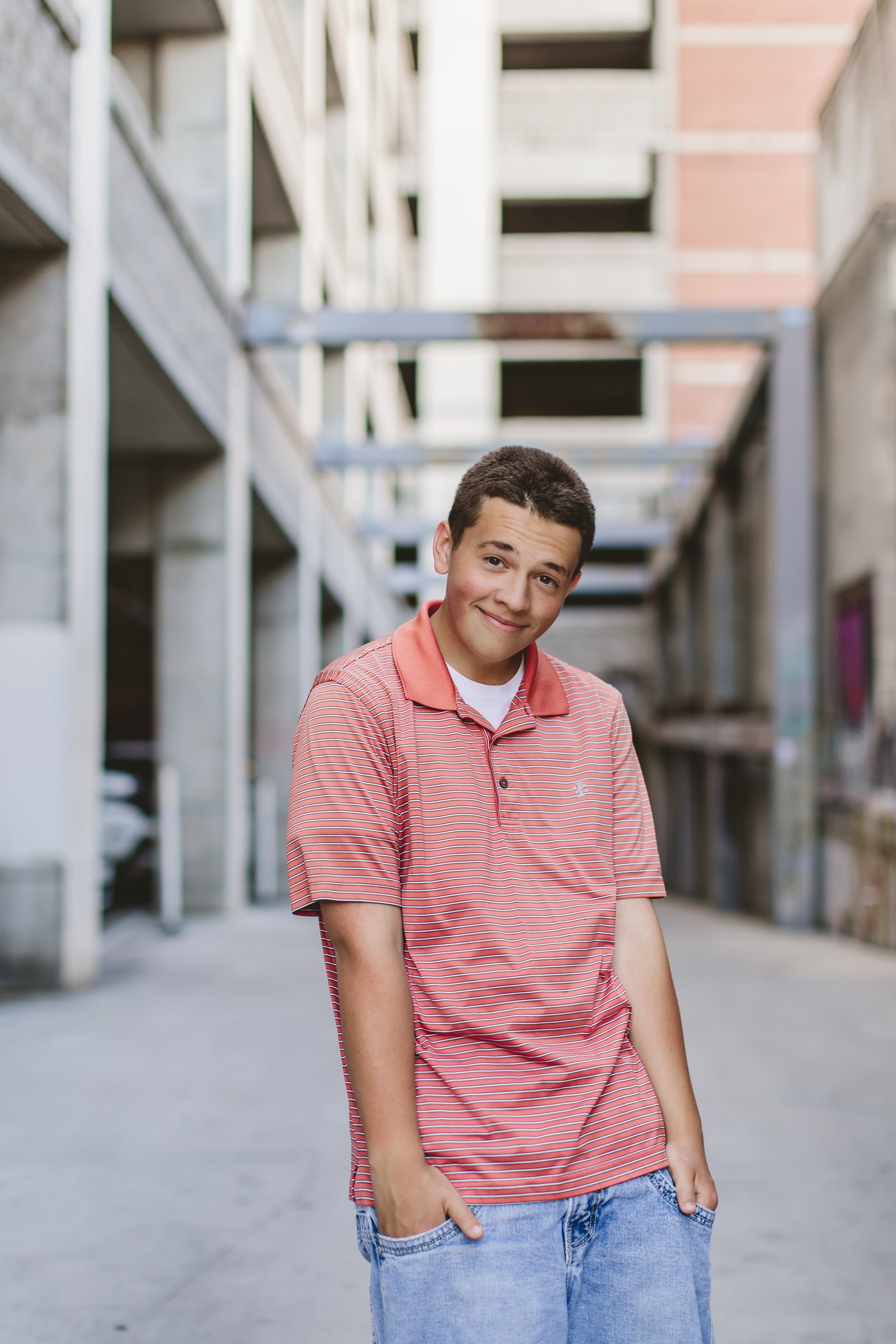 Isaac standing in an outdoor walkway